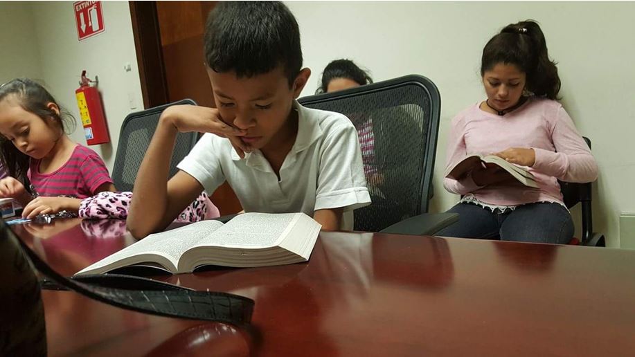 Migrant children receive the Word of God